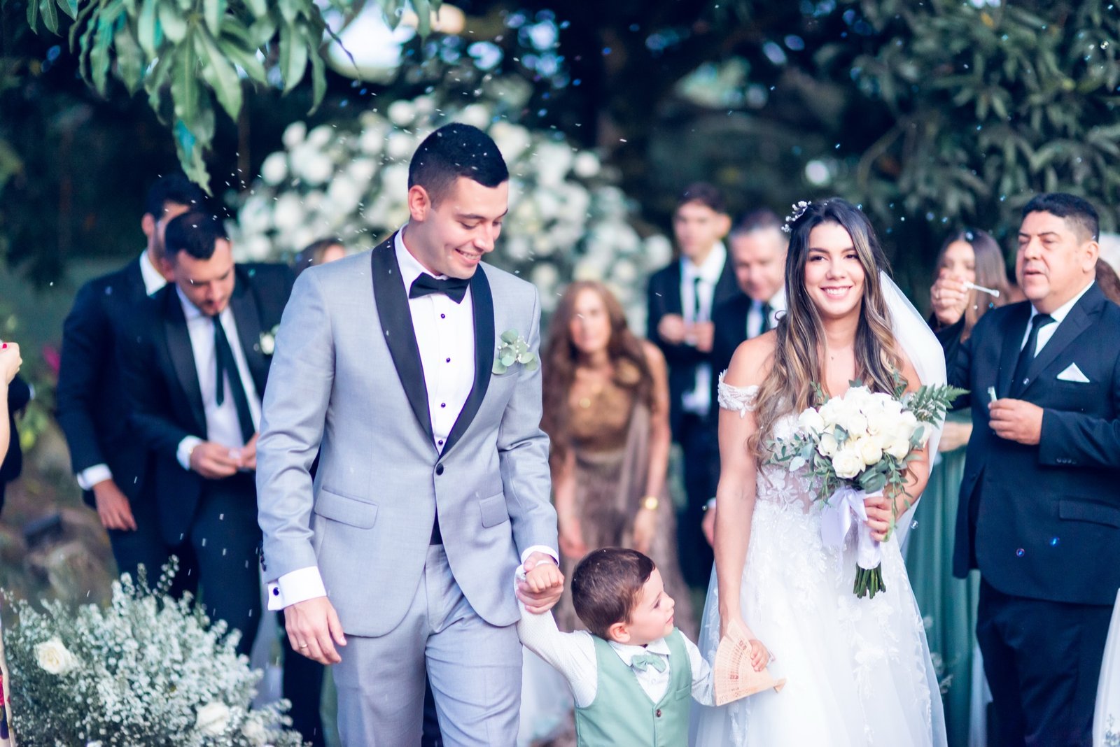Guests cheering the newlyweds during the grand exit